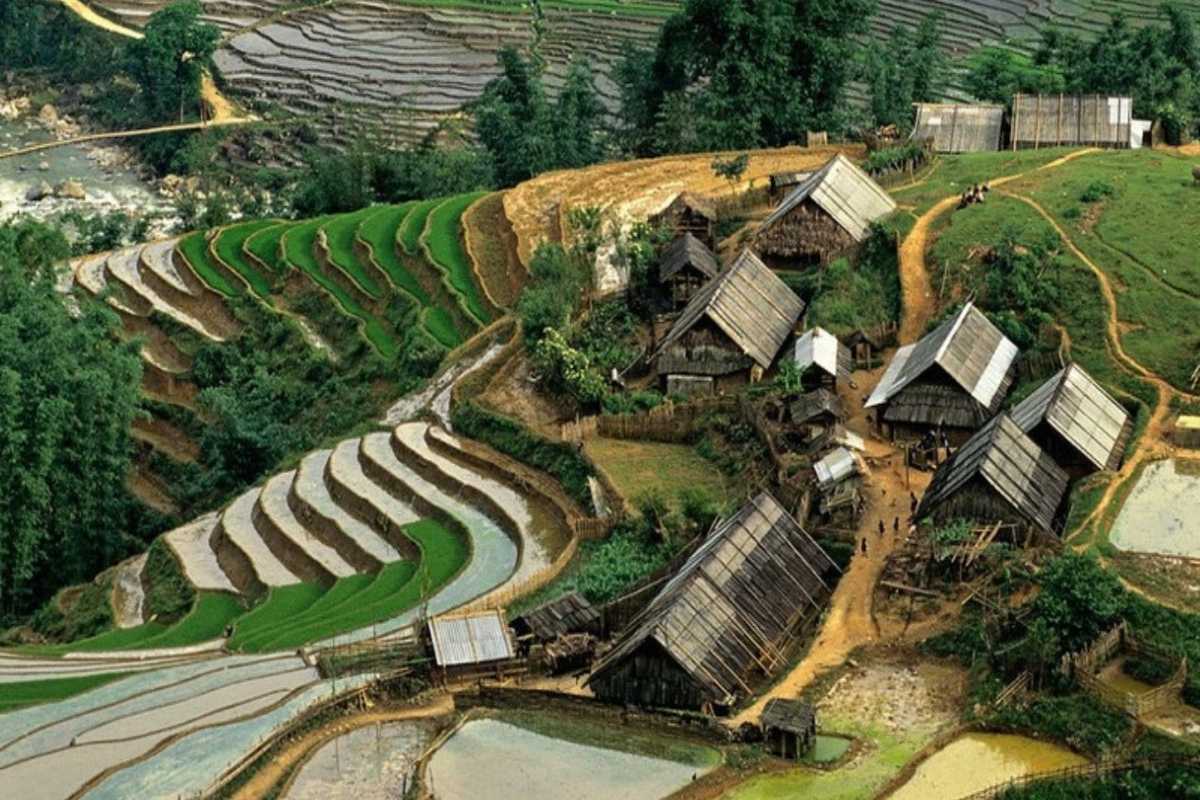 Lao Chai Village Sapa rural village and terraced paddies Lao Chai Village Sapa rural hamlet with wooden houses surrounded by layered terraced rice paddies and hills