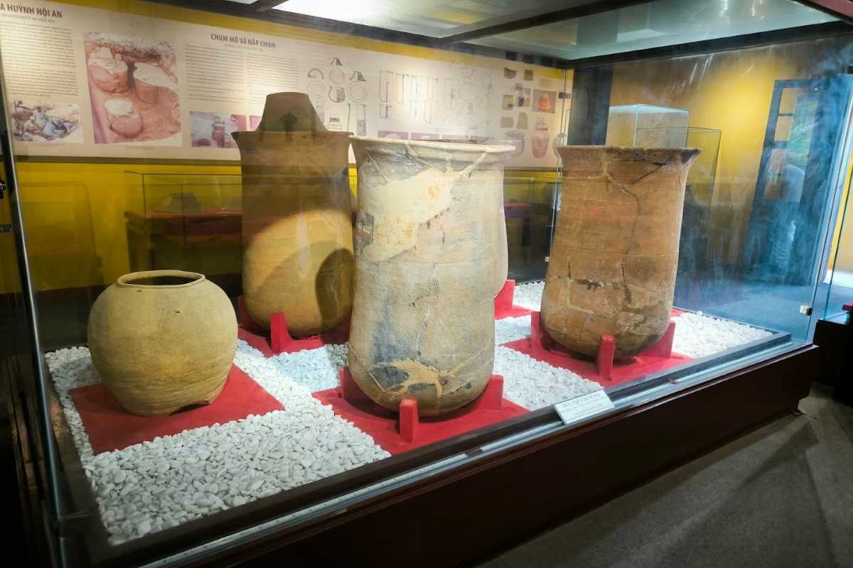Display of Large Sa Huynh Burial Jars in Museum Glass Cases Large Sa Huynh burial jars protected in glass cases at the Museum of Sa Huynh Culture, Hoi An