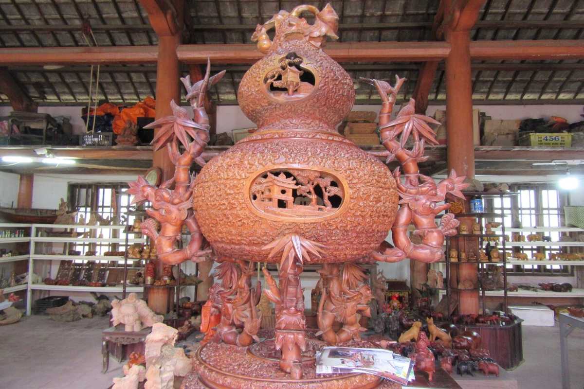 Large Intricate Wooden Sculpture Display Large detailed wooden sculpture on display inside Kim Bong Carpentry Village