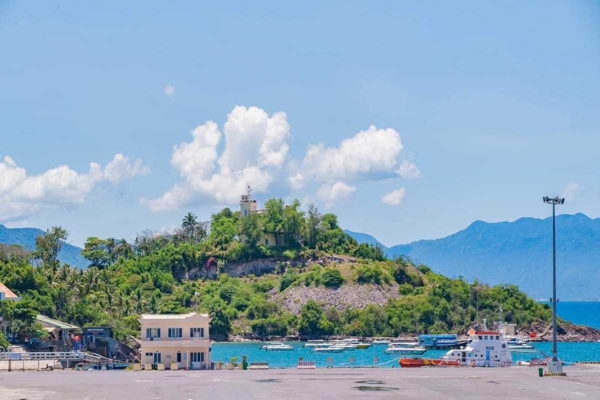 Lighthouse view from Cau Da Port Nha Trang Hilltop lighthouse and lush greenery seen from Cau Da Port Nha Trang.