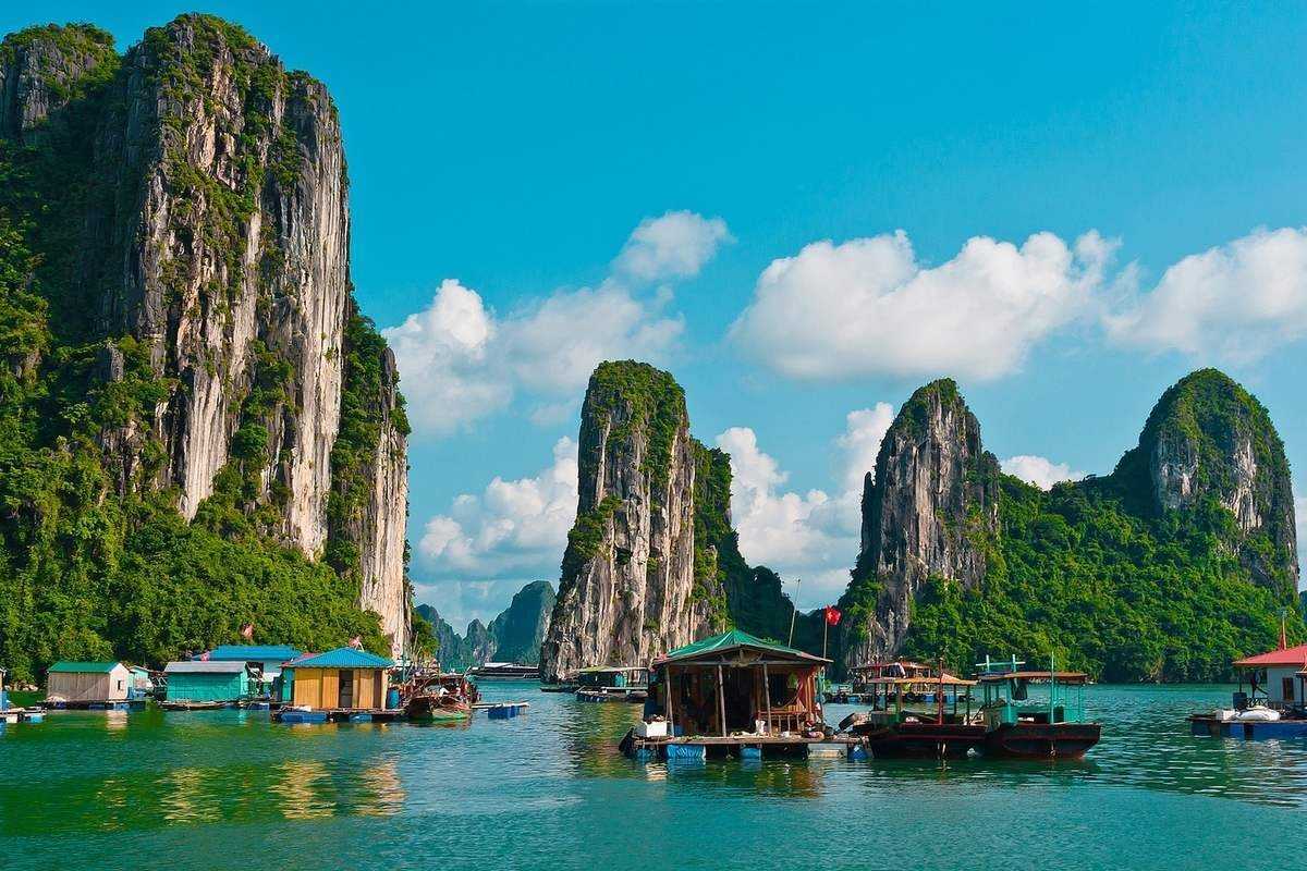 Scenic Limestone Karsts around Cong Dam Fishing Village Scenic view of limestone karsts and green waters around Cong Dam Fishing Village
