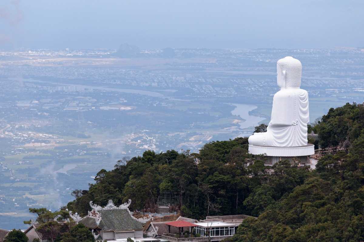 Linh Ung Pagoda Da Nang panoramic Lady Buddha mountainside view Linh Ung Pagoda Da Nang Lady Buddha statue overlooks Da Nang from the mountainside, surrounded by lush forests and panoramic city views.