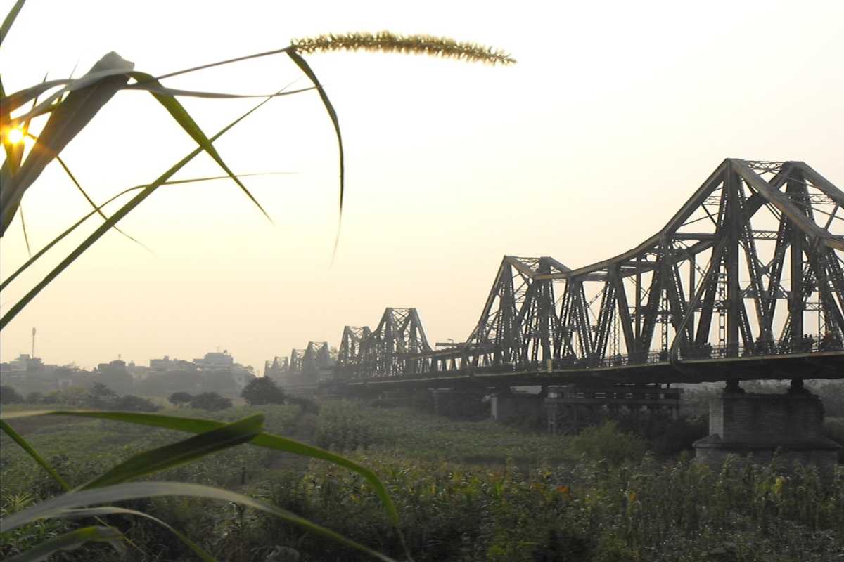 Long Bien Bridge Hanoi Morning Landscape Morning view of Long Bien Bridge stretching across the landscape with golden light