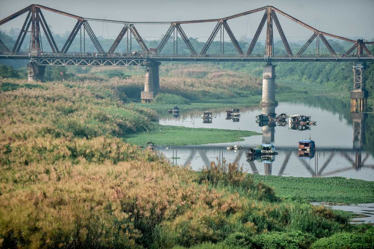 Long Bien Bridge Hanoi Urban Greenery Historic Long Bien Bridge framed by urban greenery and trees