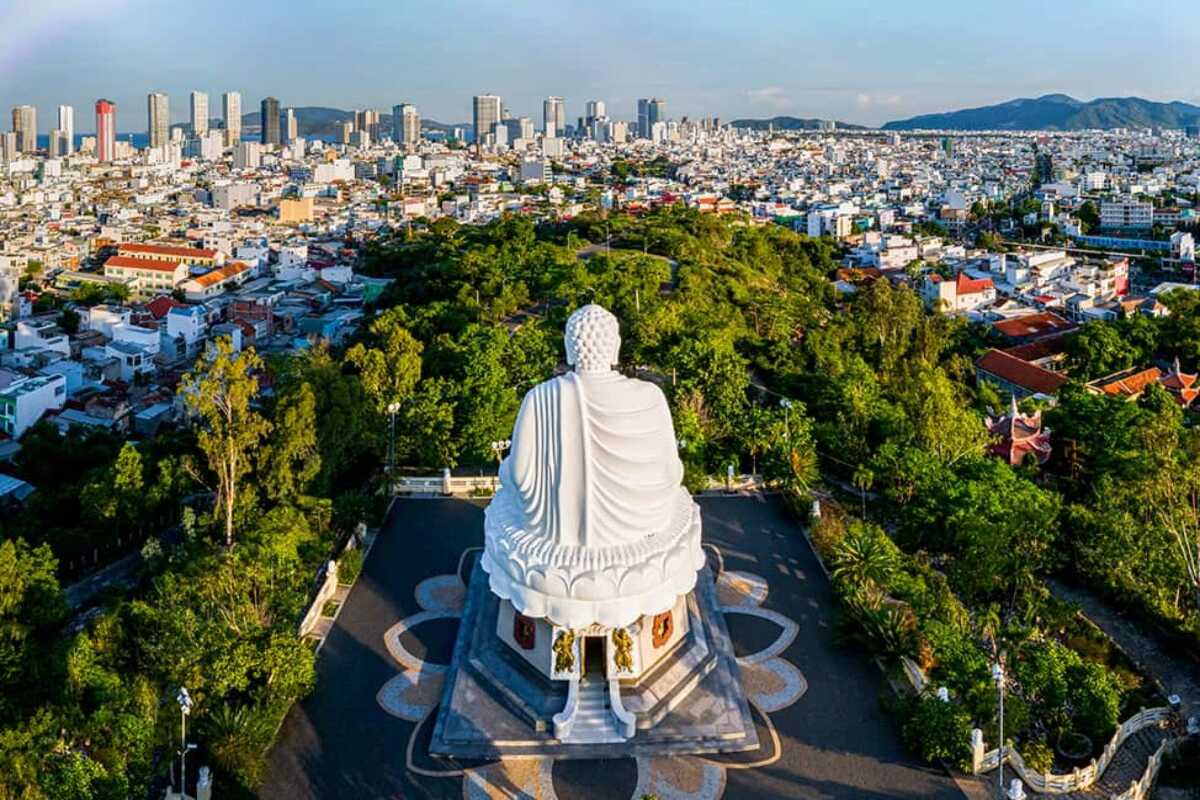 Panoramic View Over Long Son Pagoda Aerial view showing the white Buddha statue looking over Nha Trang from Long Son Pagoda hill.