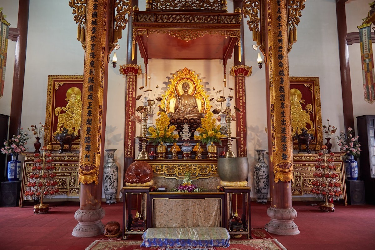 Main shrine hall with Buddha statue at Tu Dam Pagoda, Hue