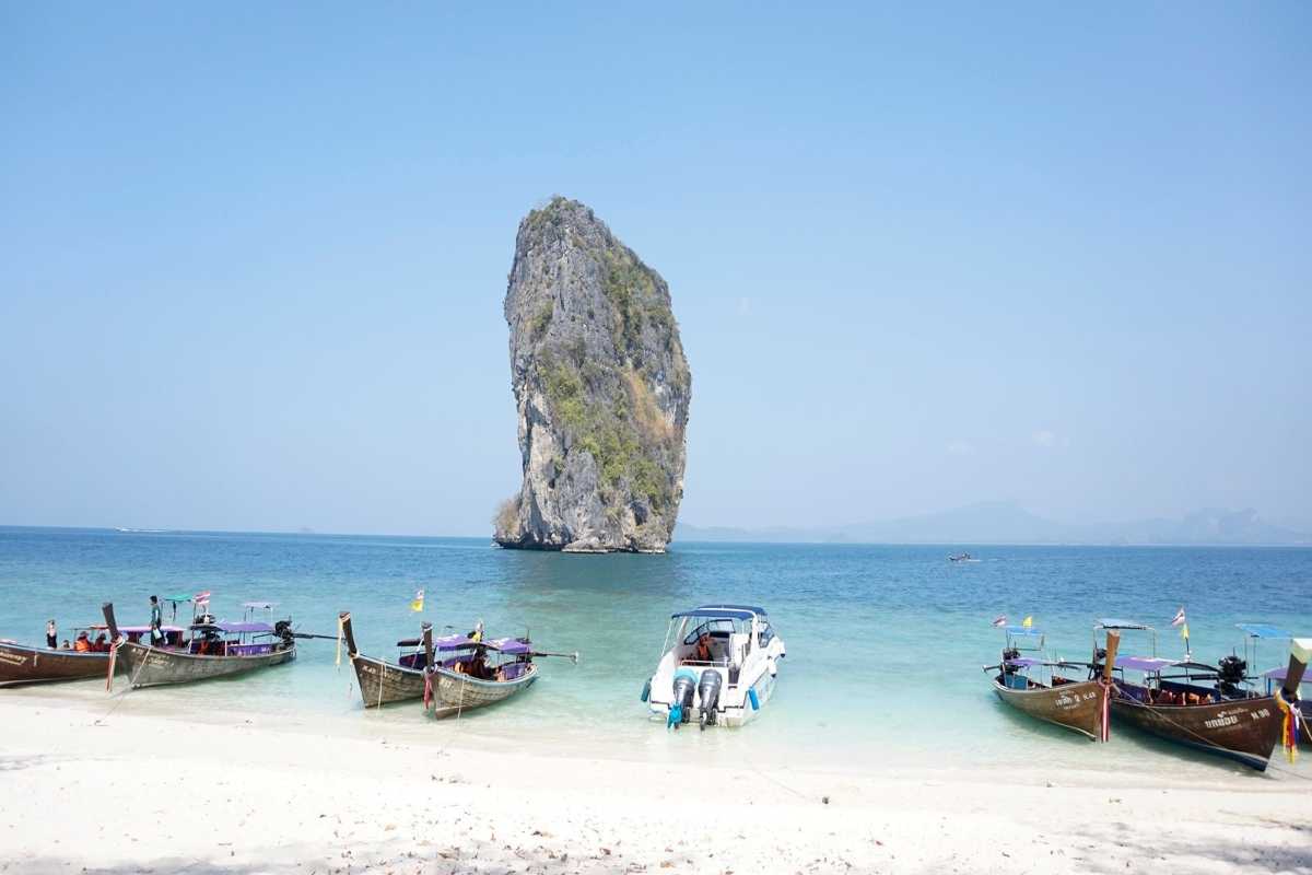 Calm Waters and Boats at Minh Chau Bay Calm sea with fishing boats floating at Minh Chau Bay near Quan Lan Island