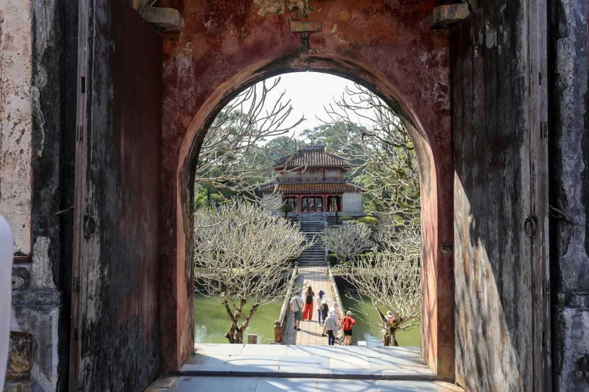 Stone Guardian Statues at Minh Mang Tomb Hue Row of stone guardian statues, including mandarins and elephants, at Minh Mang Tomb Hue’s entrance, representing royal traditions and honor.