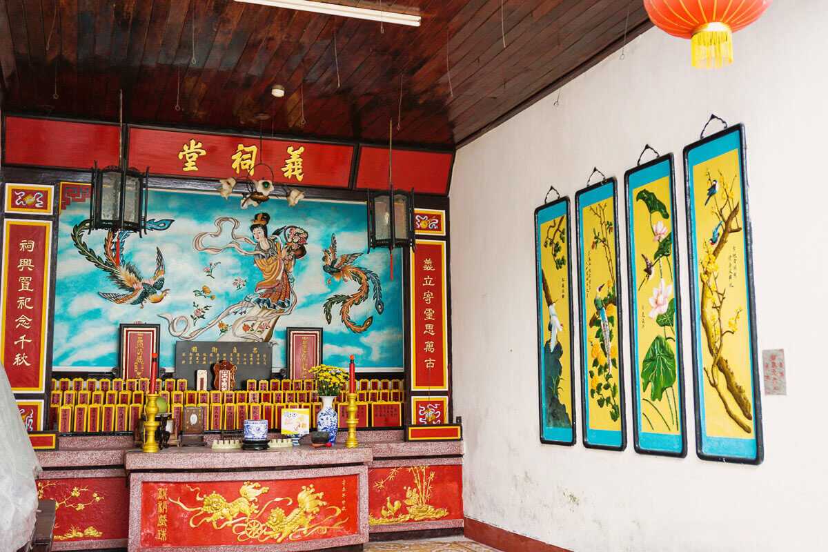 Narrow Corridor with Decorative Doors Inside Assembly Hall Narrow corridor featuring decorative doors and traditional tiles inside Cantonese Assembly Hall