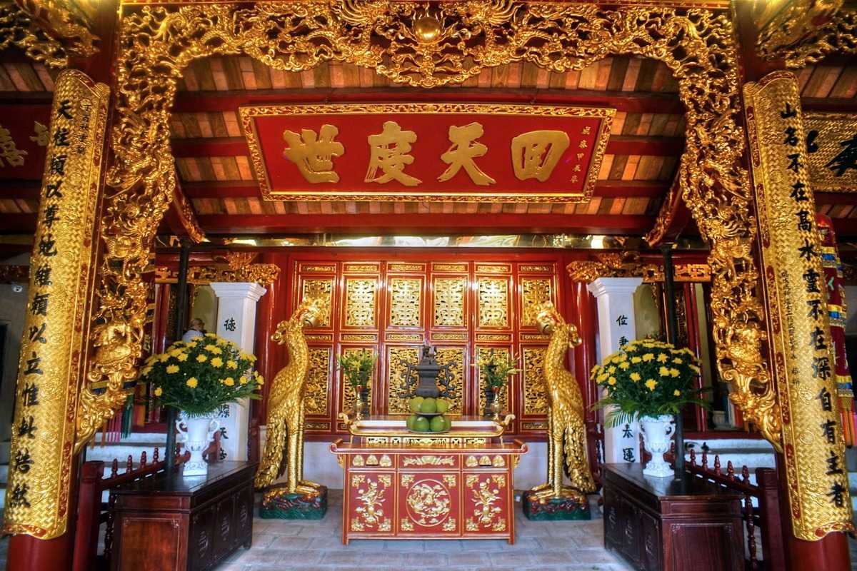 Ngoc Son Temple interior with golden carvings Ornate interior carvings and decorations at Ngoc Son Temple in Hanoi