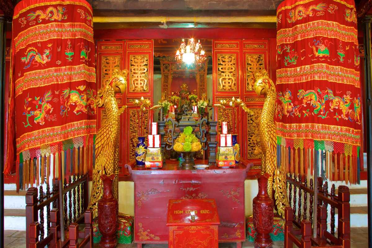 Vibrant Interior of Ngoc Son Temple Colorful interior with red pillars and ornate decorations inside Ngoc Son Temple in Hanoi