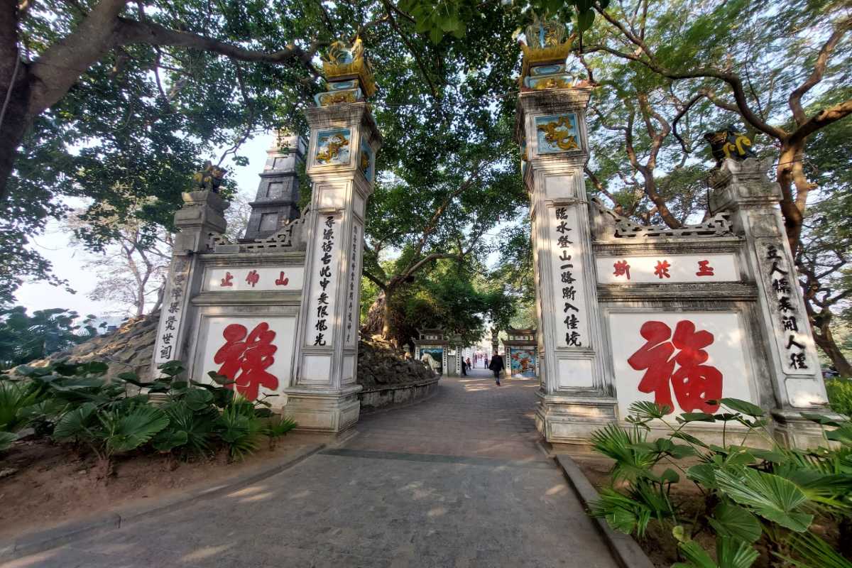 Ngoc Son Temple main gate with calligraphy Main stone gate with traditional Vietnamese calligraphy at Ngoc Son Temple