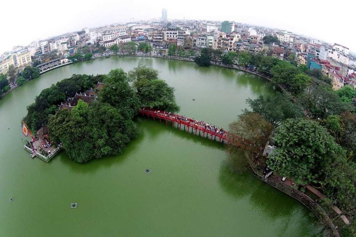 Ngoc Son Temple wide view with cityscape Wide-angle view of Ngoc Son Temple on Hoan Kiem Lake with Hanoi cityscape background
