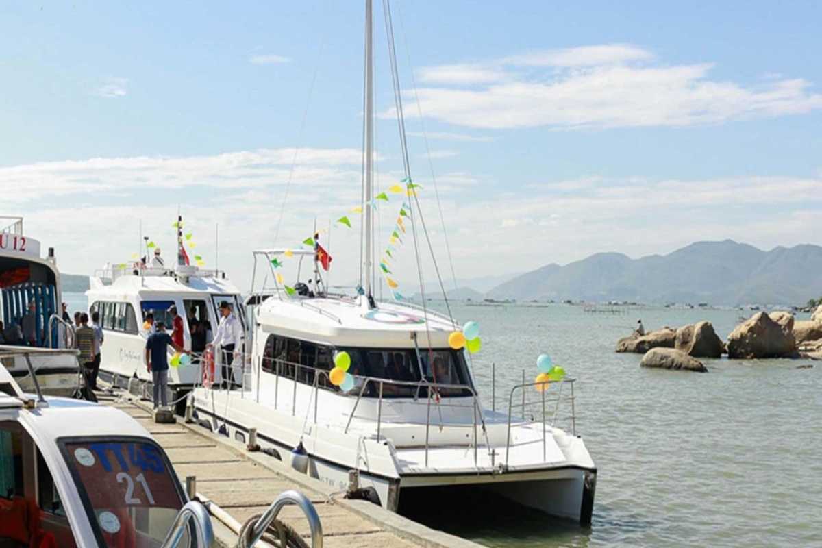 Tour boats docked at the pier in Nha Phu Bay, a scenic coastal area in Nha Trang known for its marine activities and island tours.