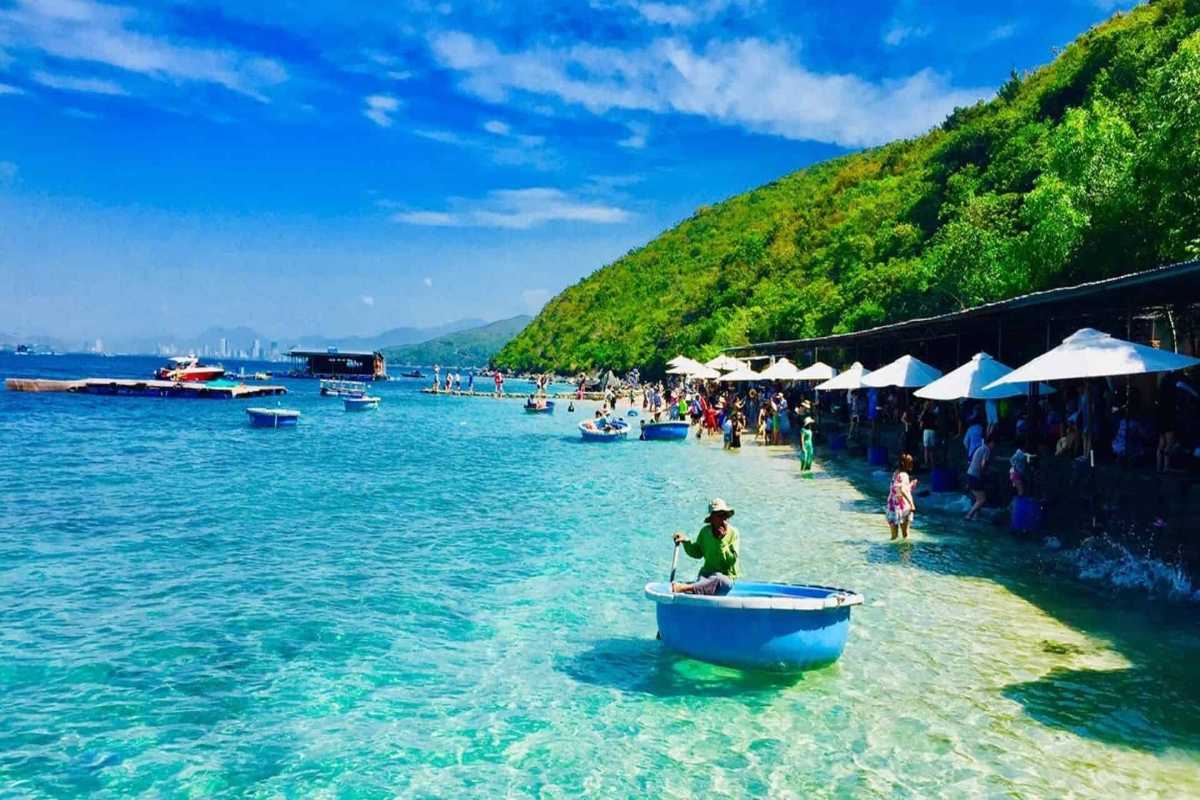 Clear turquoise waters and scenic shoreline at Nha Phu Lagoon Nha Trang surrounded by lush greenery