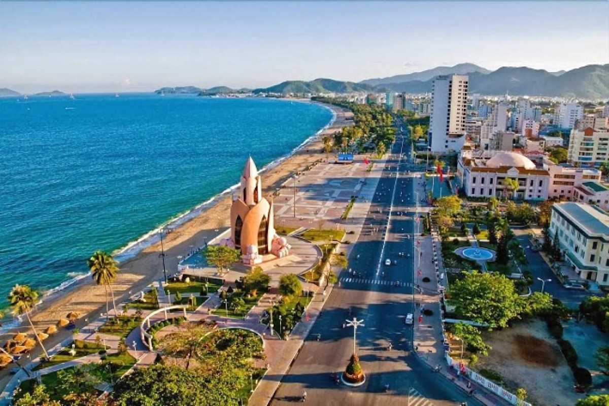 Nha Trang beachfront and lotus tower Scenic view of Nha Trang beachfront with Lotus Tower and surrounding roads under blue sky