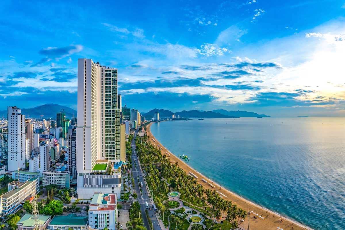 Nha Trang skyscraper beachfront Nha Trang beach with skyscraper hotels along the boulevard and palm-lined shoreline