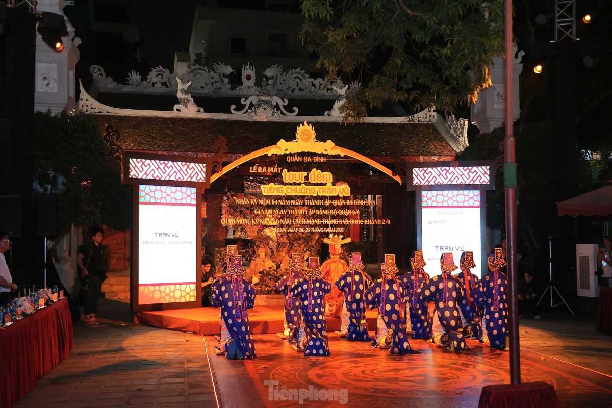 Night Festival Performance at Quan Thanh Temple Traditional night festival with performers in ceremonial attire at Quan Thanh Temple