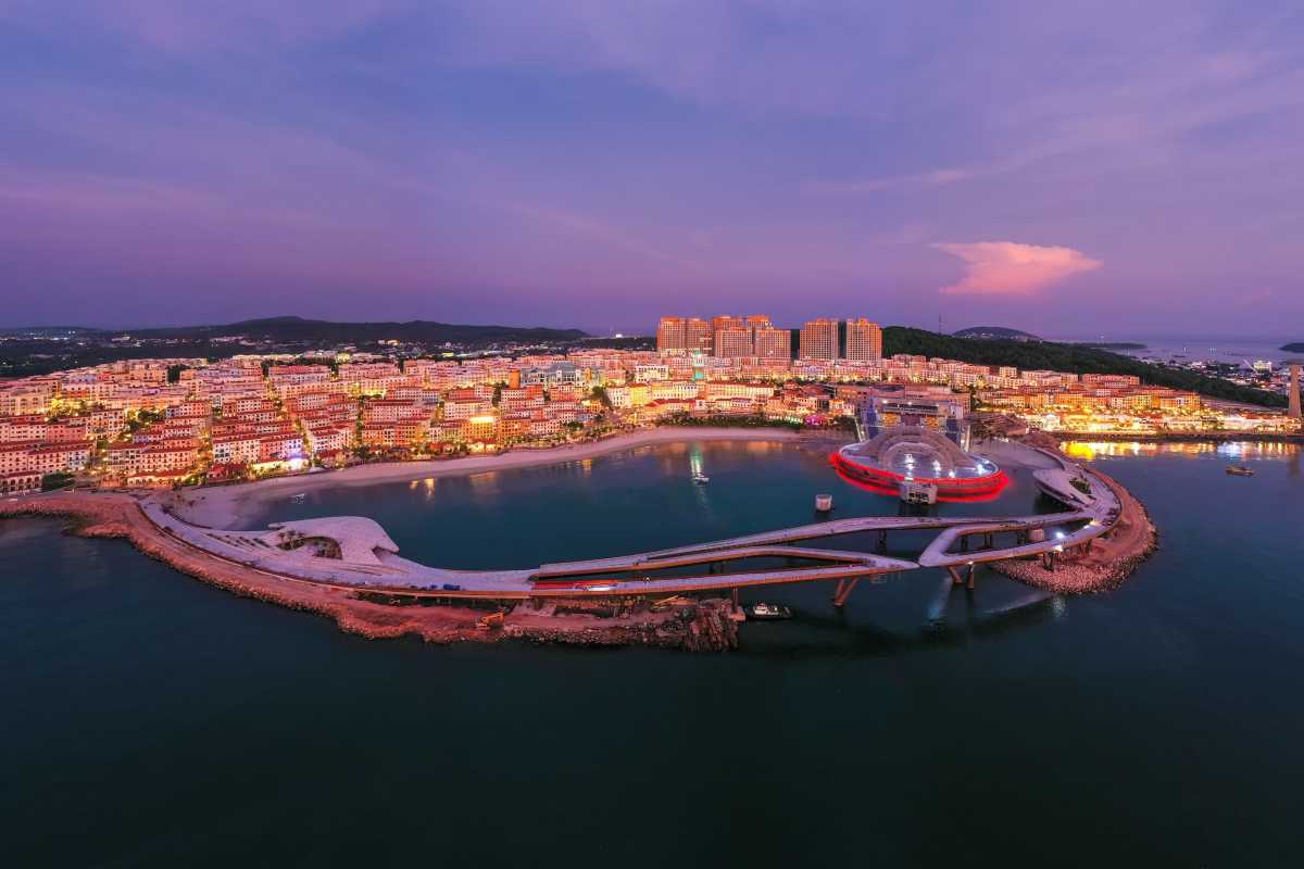 Night View of Kiss Bridge Phu Quoc Evening aerial photo showing Kiss Bridge illuminated with city lights on Phu Quoc Island