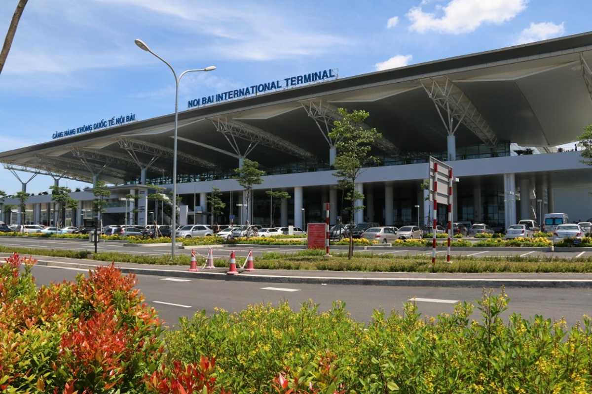 Noi Bai International Airport Exterior View Exterior view of Noi Bai International Airport terminal with clear skies and surrounding greenery