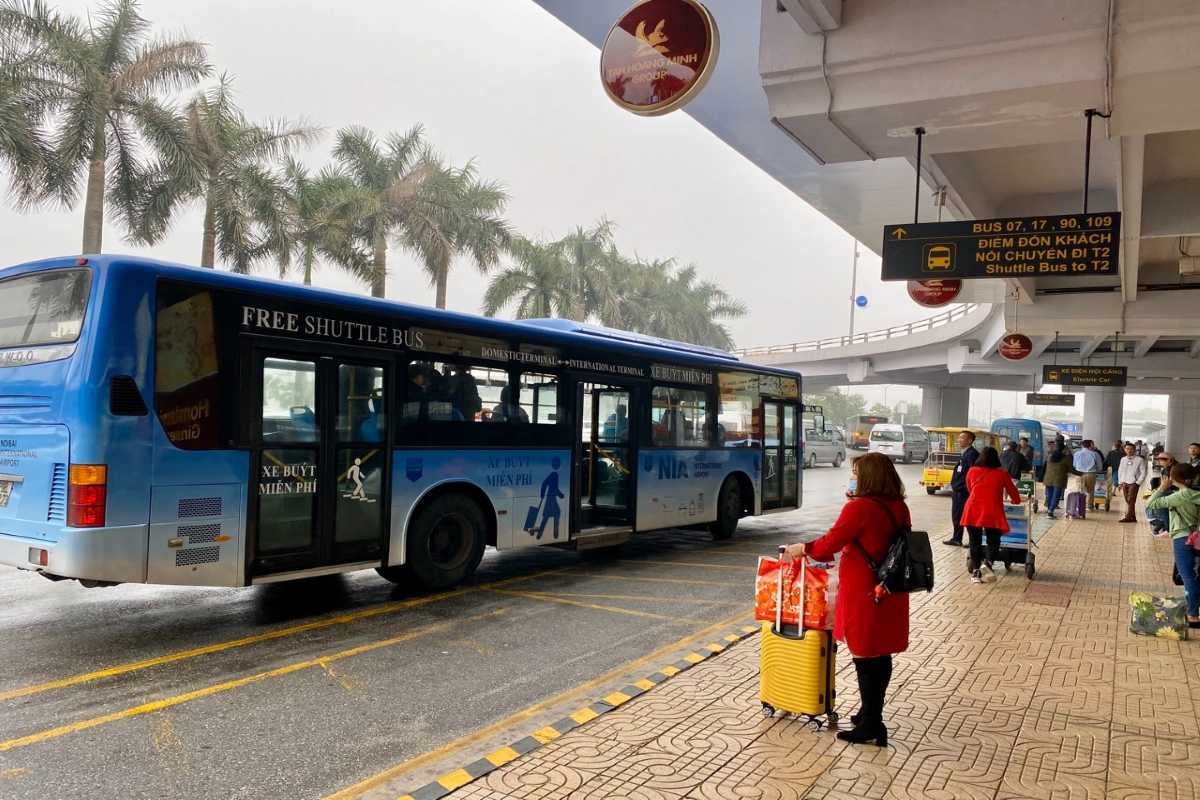 Noi Bai International Airport Shuttle Bus Service Shuttle bus parked outside terminal at Noi Bai International Airport