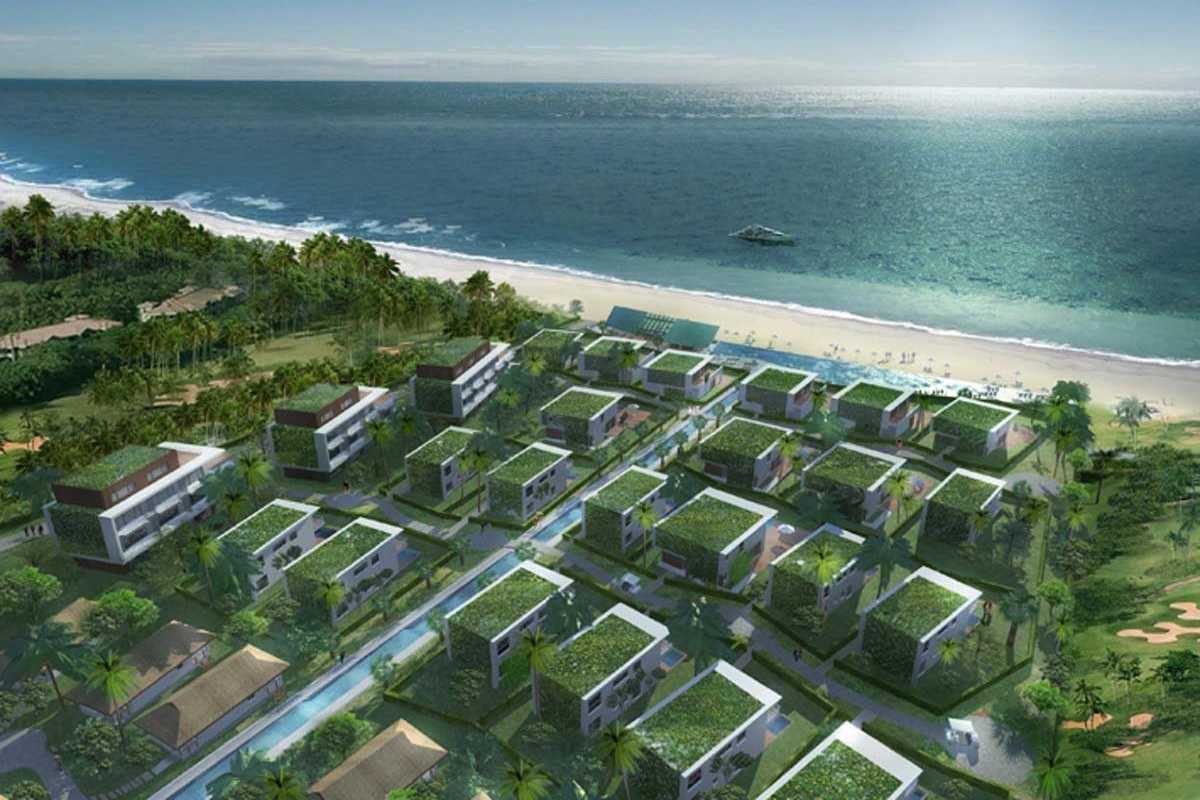 Non Nuoc Beach Da Nang eco-friendly seaside villas aerial view Non Nuoc Beach Da Nang eco villas with green rooftops stretch along the coastline for an eco-conscious retreat.
