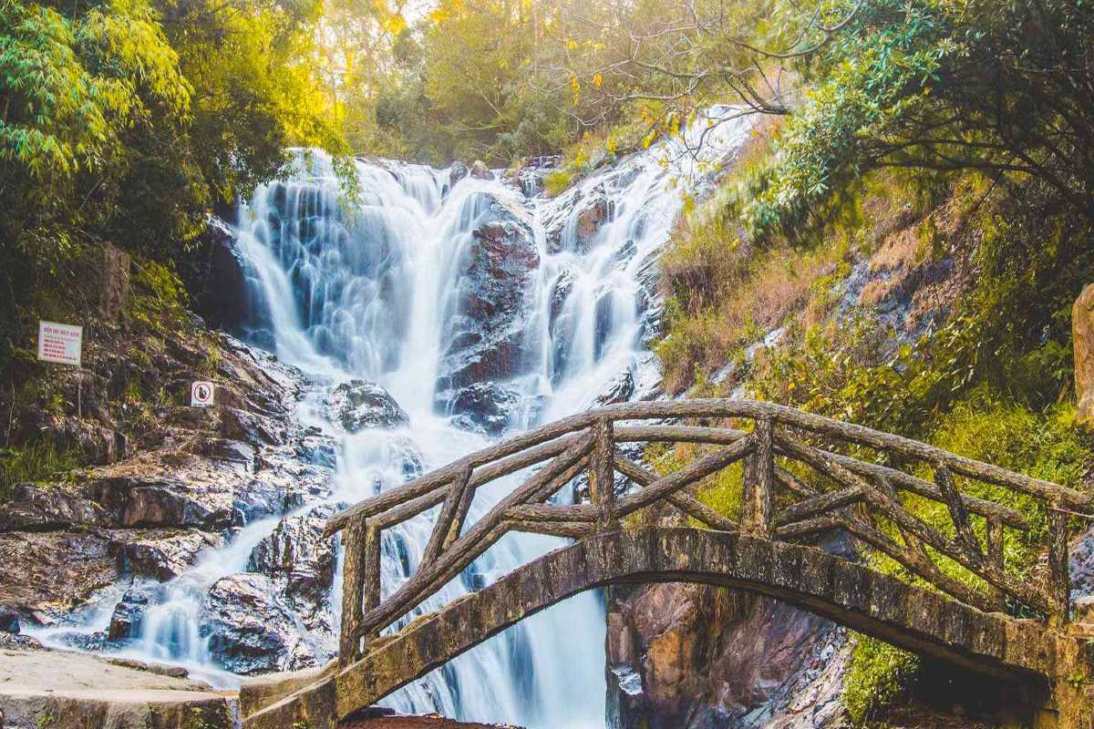 Panoramic View of Cascading Datanla Waterfalls Wide view of multi-tiered cascades at Datanla Waterfalls surrounded by green forest in Da Lat