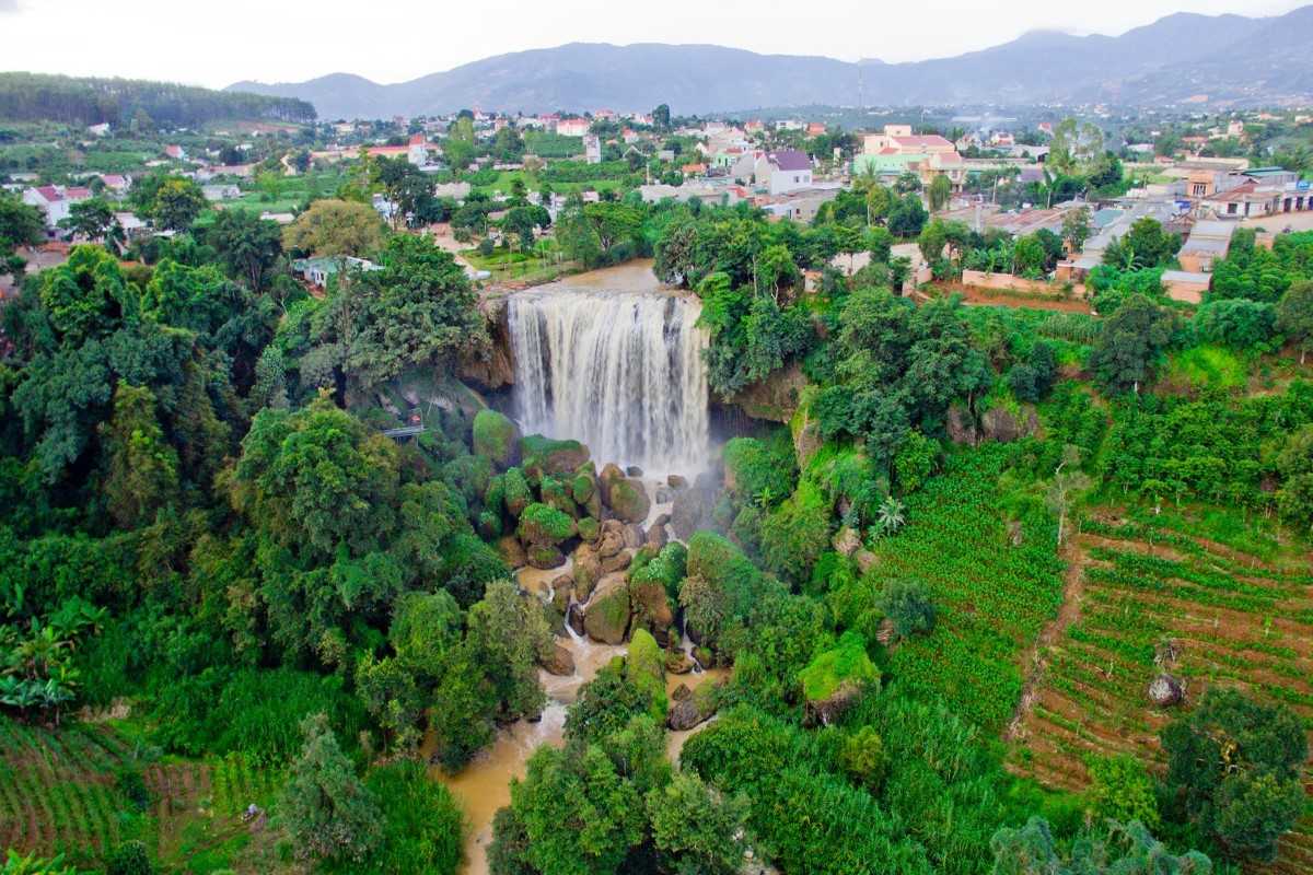 Panoramic View of Elephant Waterfall in Da Lat Panoramic view of the Elephant Waterfall, showcasing the landscape and surrounding town in Da Lat.