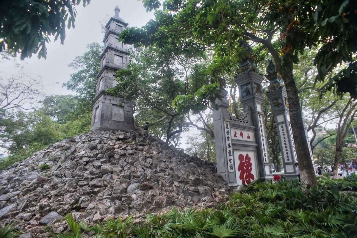 Pen Tower Close-up with Red Chinese Characters Close-up of Pen Tower’s stone structure with red Chinese characters in Hanoi