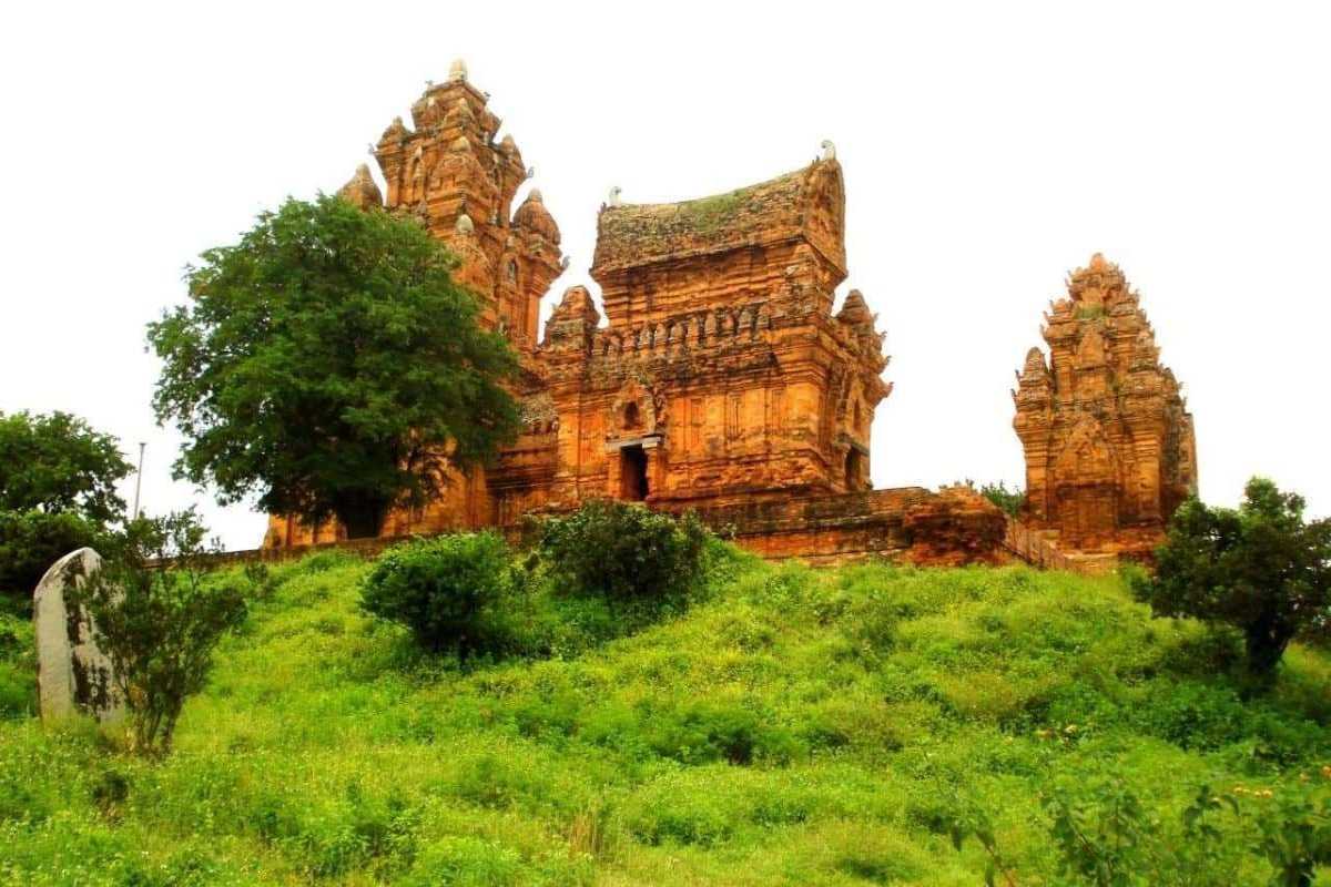 Cham Towers on Hilltop in Phan Rang Hilltop view of historic Cham Towers surrounded by greenery near Phan Rang City