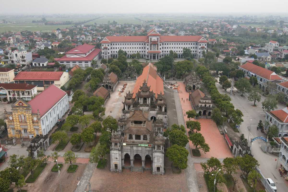 Phat Diem Cathedral Ninh Binh complete grounds from above Aerial perspective of Phat Diem Cathedral Ninh Binh with full grounds, church, chapels, and gardens