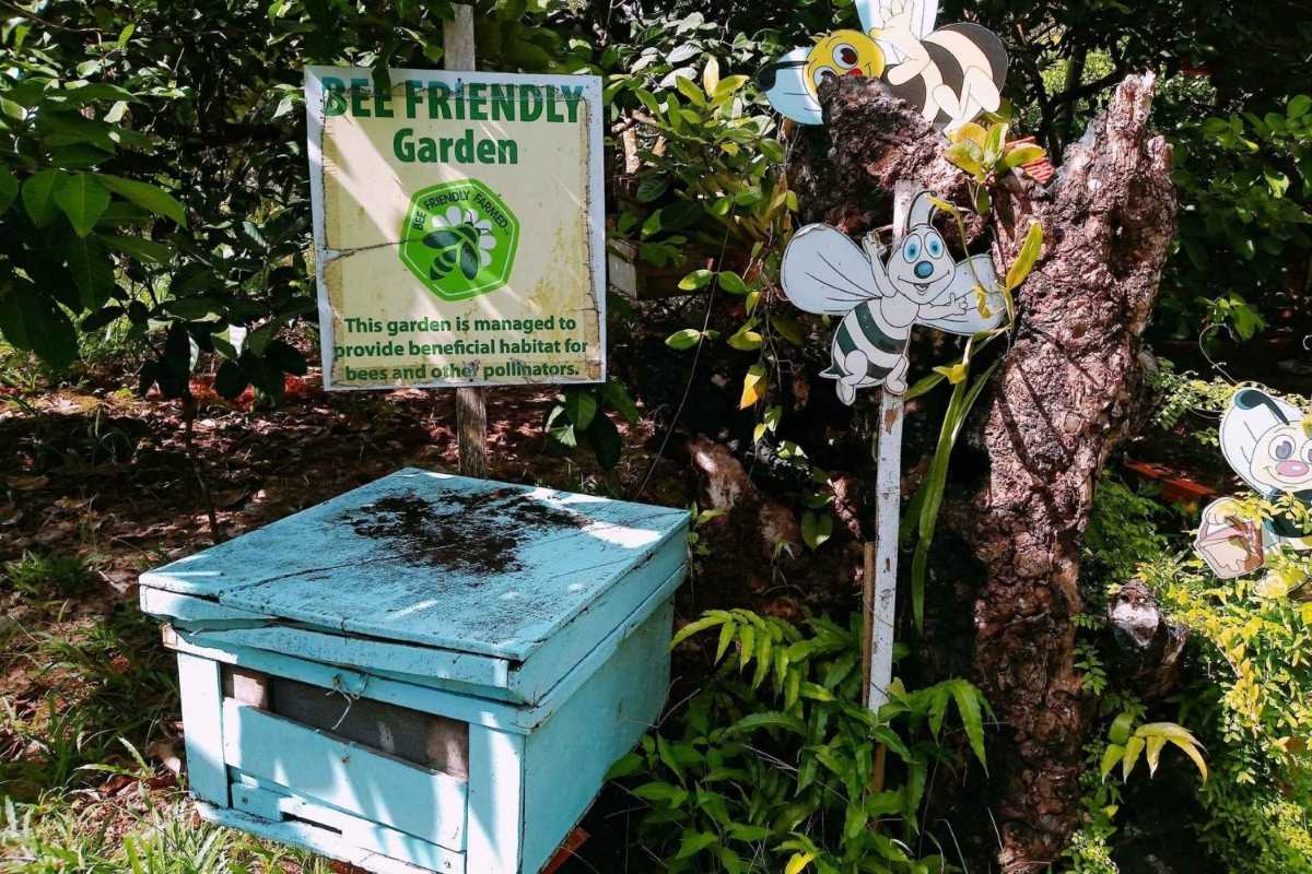 Sign promoting bee-friendly garden at Phu Quoc Bee Farm Sign highlighting bee-friendly garden habitat supporting pollinators at Phu Quoc Bee Farm