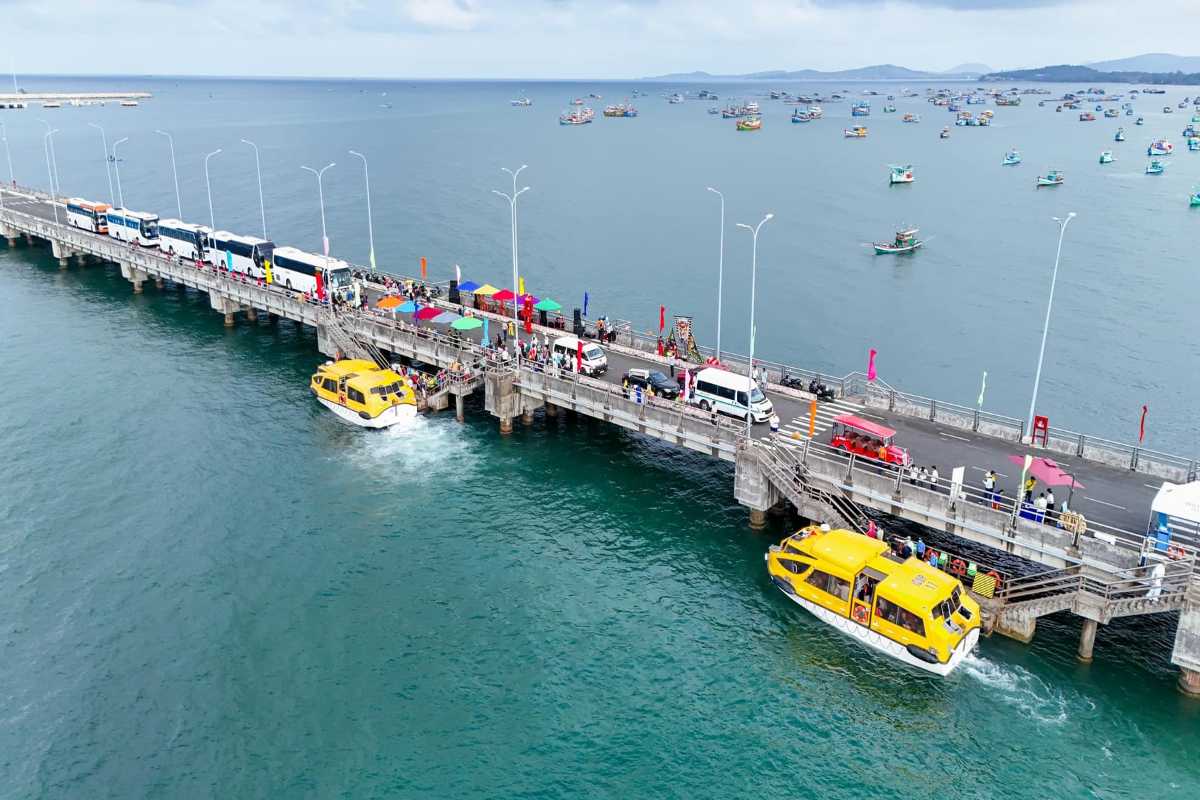 Phu Quoc International Cruise Terminal Passenger Pier Aerial View Aerial view of Phu Quoc International Cruise Terminal passenger pier with buses and boats in harbor