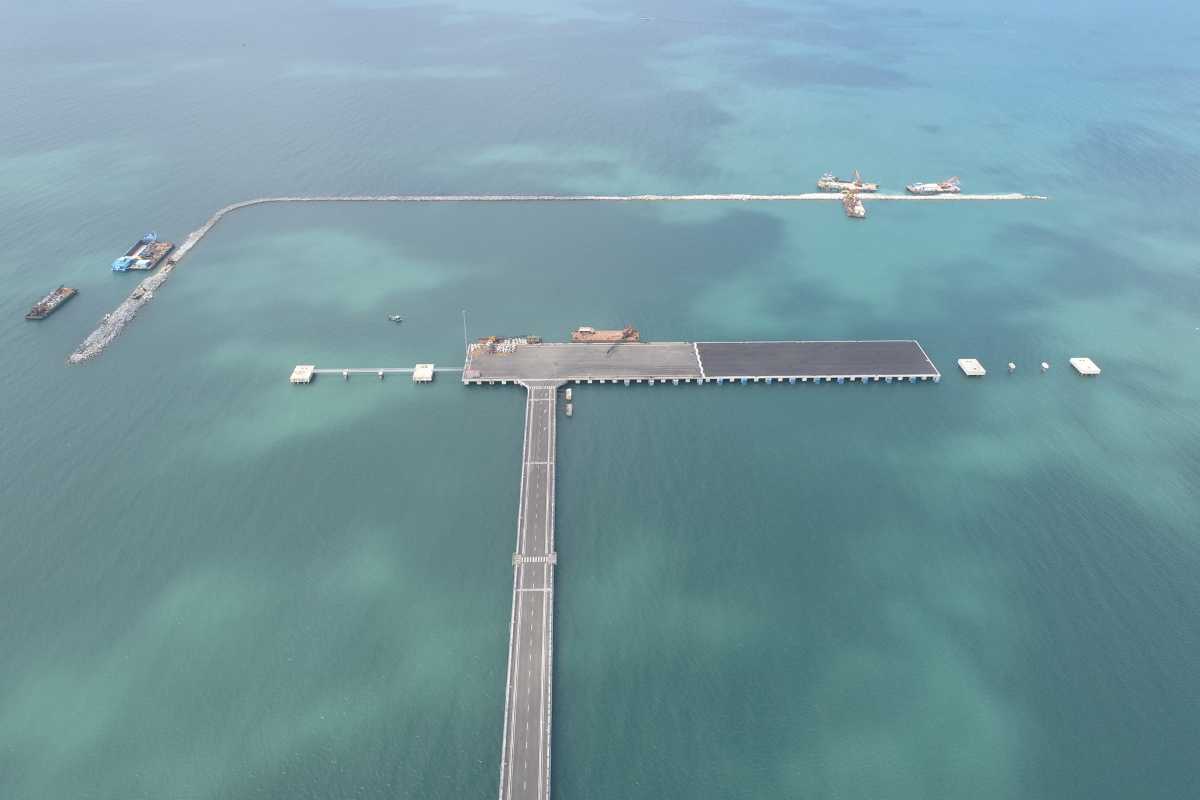 Phu Quoc International Cruise Terminal Pier Aerial View Aerial view of Phu Quoc International Cruise Terminal pier extending into clear waters with boats nearby