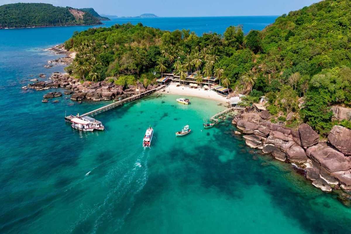 Scenic Fishing Village at Phu Quoc Island Traditional fishing boats in turquoise waters near a small fishing village on Phu Quoc Island.