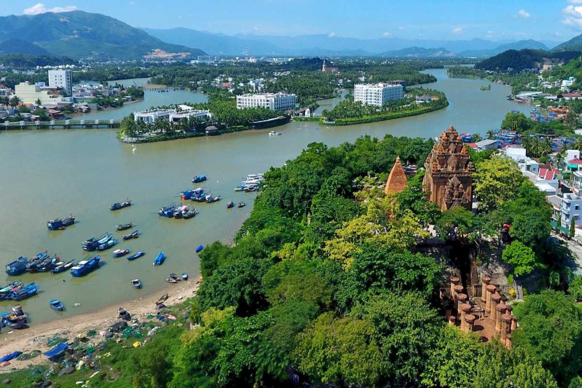 Po Nagar Cham Towers by the river Ancient Cham temple towers surrounded by greenery next to a river bend in Nha Trang