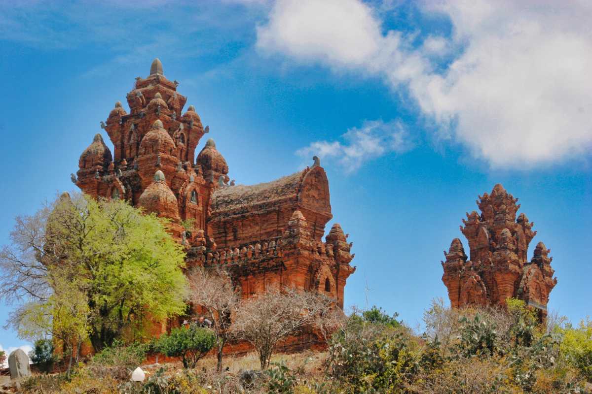 Po Rome Tower and Cham Heritage Site Phan Rang Thap Cham Po Rome Tower and adjacent Cham heritage buildings under sunny sky in Phan Rang Thap Cham