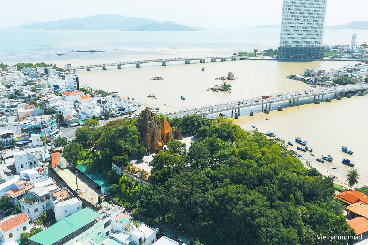 Ponagar Cham Towers and Trần Phú Bridge view View of Ponagar Cham Towers in Nha Trang near Trần Phú Bridge with sea and boats in background