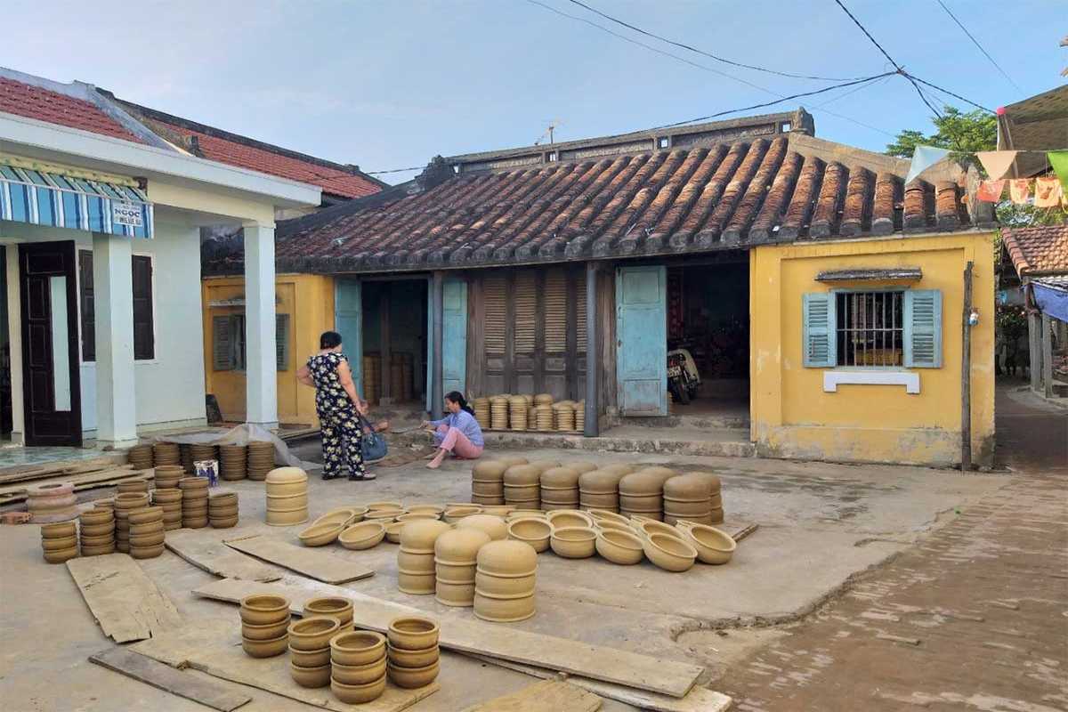 Traditional Pottery Drying Area at Thanh Ha Pottery Village Traditional pottery drying outdoors on wooden boards at Thanh Ha Pottery Village near Hoi An