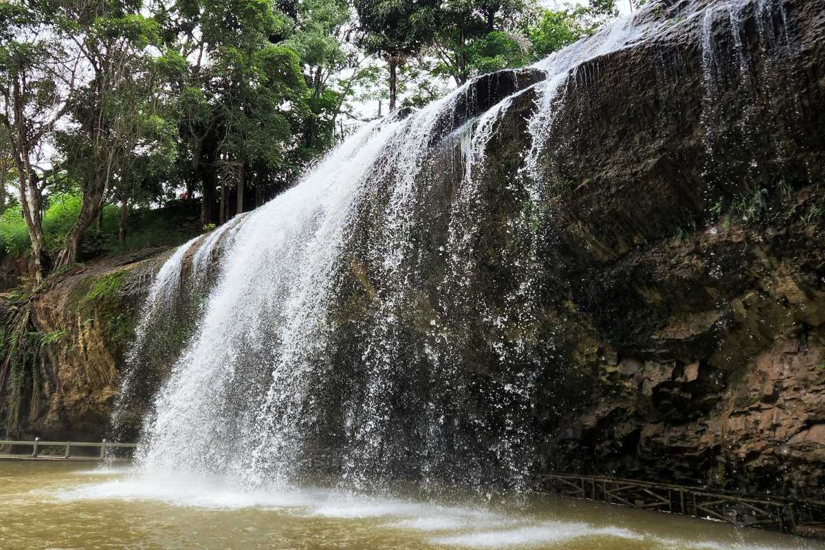 Prenn Waterfall Da Lat bright daylight scenery Prenn Waterfall Da Lat showing bright daylight with lush trees and flowing waterfall creating a vibrant atmosphere.