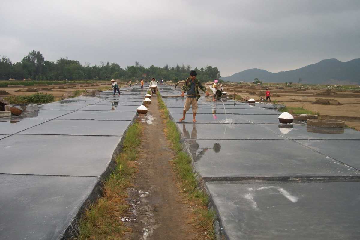 Preparing Salt Pans at Hon Khoi Salt Fields Salt pans prepared for seawater evaporation at Hon Khoi Salt Fields in Nha Trang coastal region.