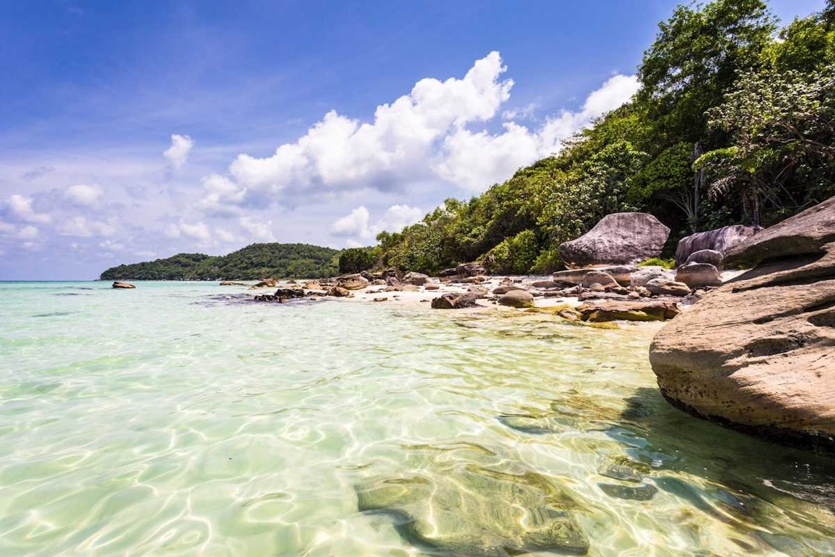 Pristine beach with turquoise water in An Thoi Pristine sandy beach with turquoise water and lush greenery at An Thoi Archipelago