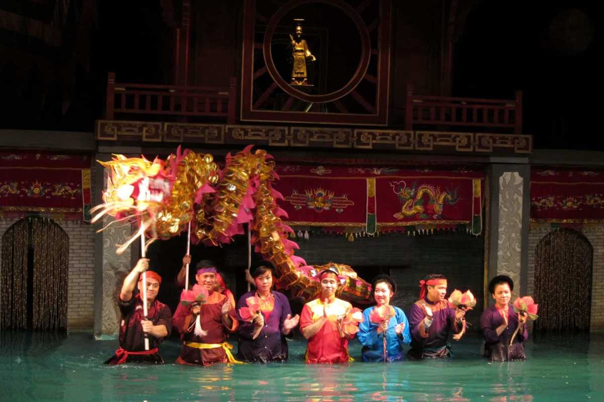 Puppeteers with Water Puppets Taking a Bow Puppeteers and water puppets bowing at the end of a performance at Thang Long Theatre