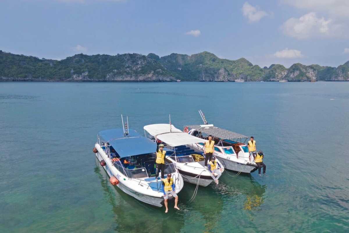 White sand beach and clear blue water on Quan Lan Island White sandy beach and clear blue sea waters at Quan Lan Island under a sunny sky