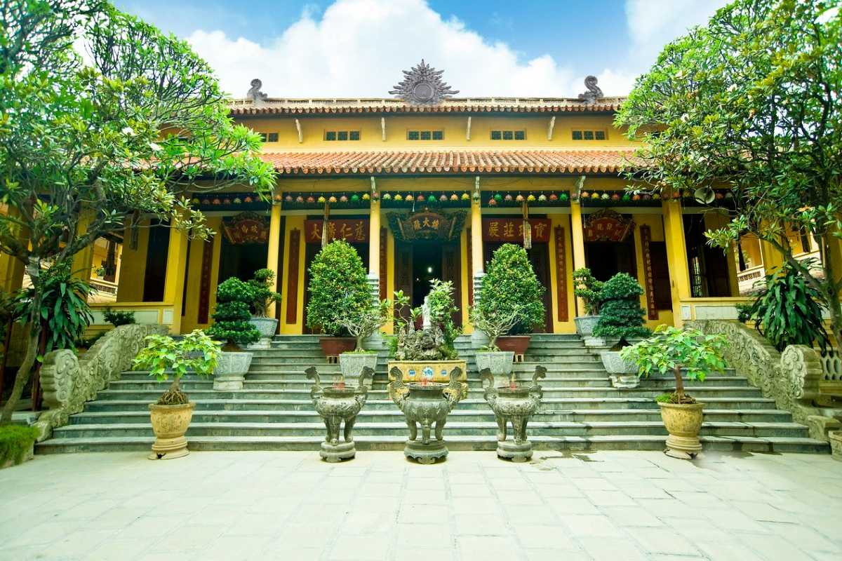 Courtyard and Lanterns at Quan Su Pagoda Hanoi Vibrant courtyard with red lanterns and stone stairway inside Quan Su Pagoda, Hanoi