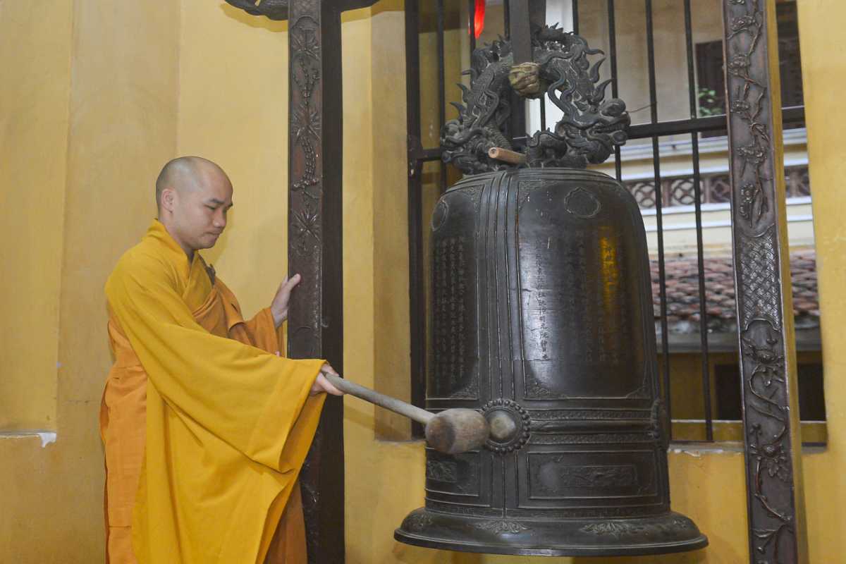 Entrance Gate of Quan Su Pagoda Hanoi The main ornate yellow entrance gate with traditional Vietnamese architecture
