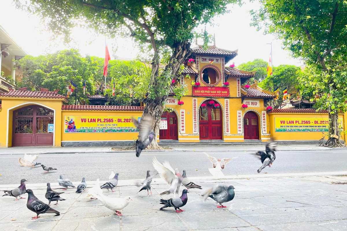 Front Entrance of Quan Su Pagoda Hanoi Busy street scene outside the ornate entrance gate of Quan Su Pagoda in Hanoi