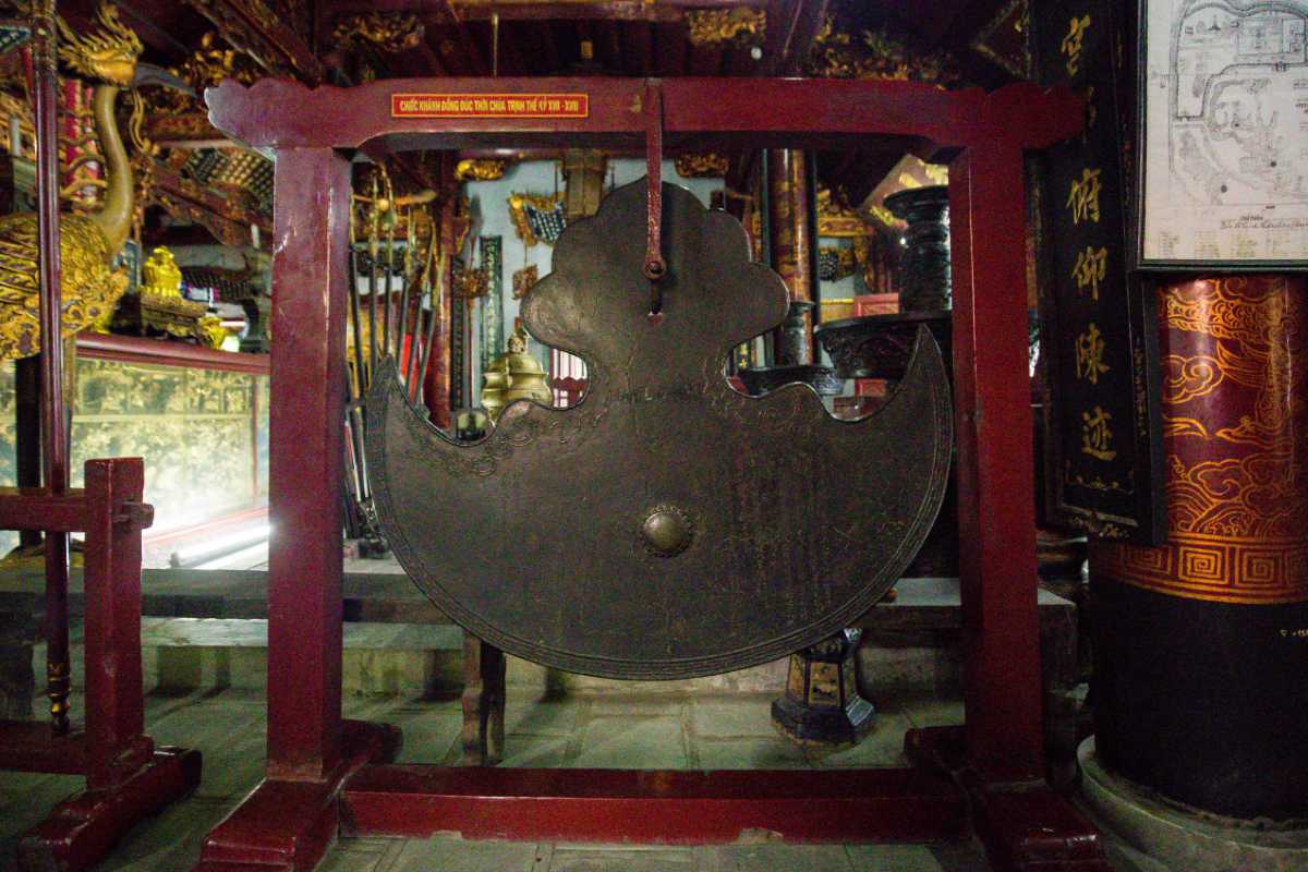 Quan Thanh Temple Bronze Gong Interior Interior view of Quan Thanh Temple featuring the large bronze gong and intricate decorations