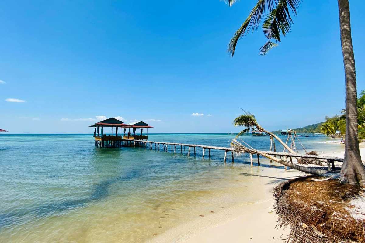 Coastal Stilt Houses and Palm Trees at Rach Vem Traditional coastal stilt houses backed by palm trees at Rach Vem Fishing Village, Phu Quoc