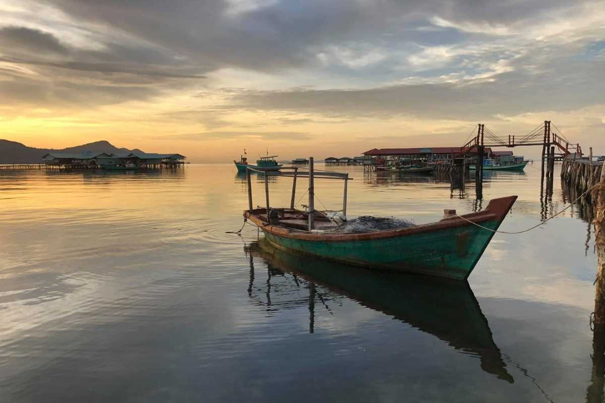 Sunset View at Rach Vem Pier Golden sunset lighting up Rach Vem pier and coastal waters at Phu Quoc fishing village
